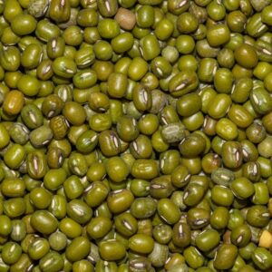 Detailed close-up image of green mung beans arranged in a pattern, perfect for food backgrounds.